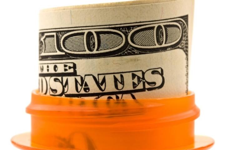 dollar bill in a prescription pill bottle