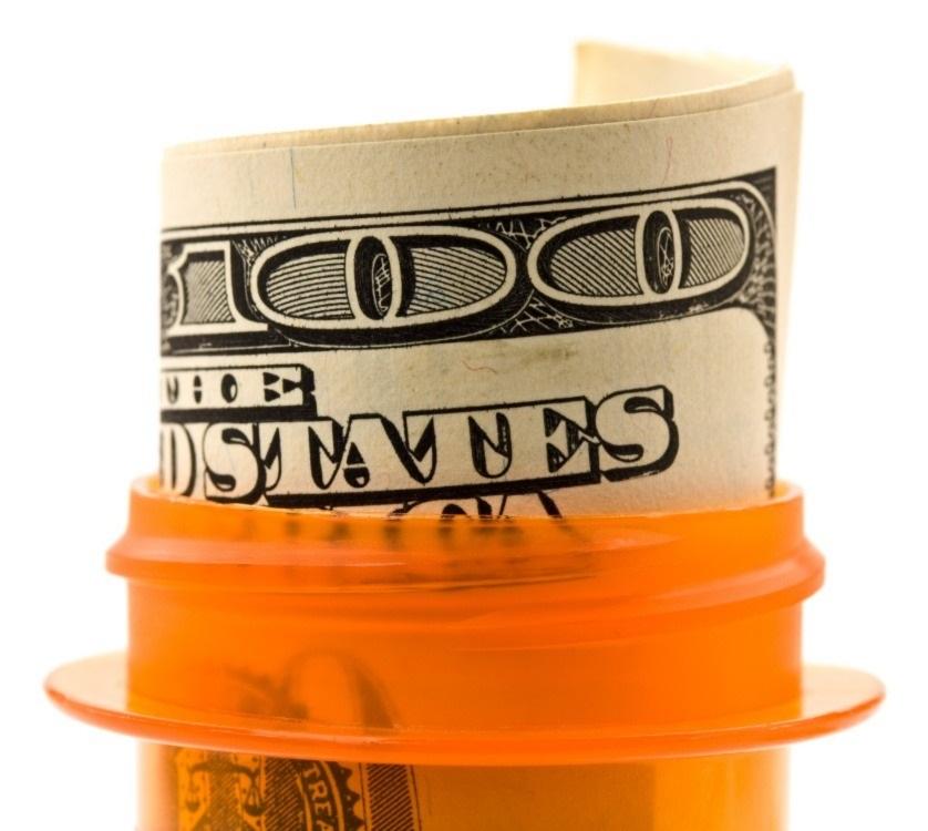 dollar bill in a prescription pill bottle
