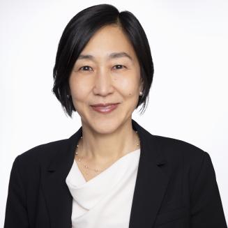 Alice Hm Chen in a dark jacket and white shirt